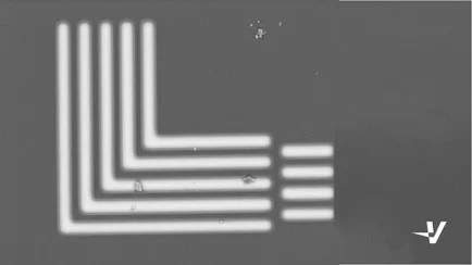 Scanning electron micrograph of 1 µm line/space resist patterned by an LLS1000 on a silicon wafer