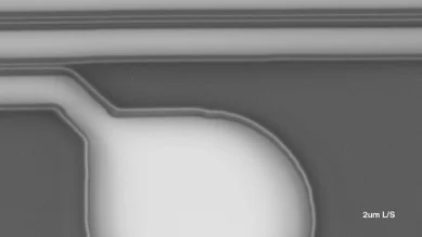 Scanning electron micrograph of a patterned resist edge below 1 micrometre
